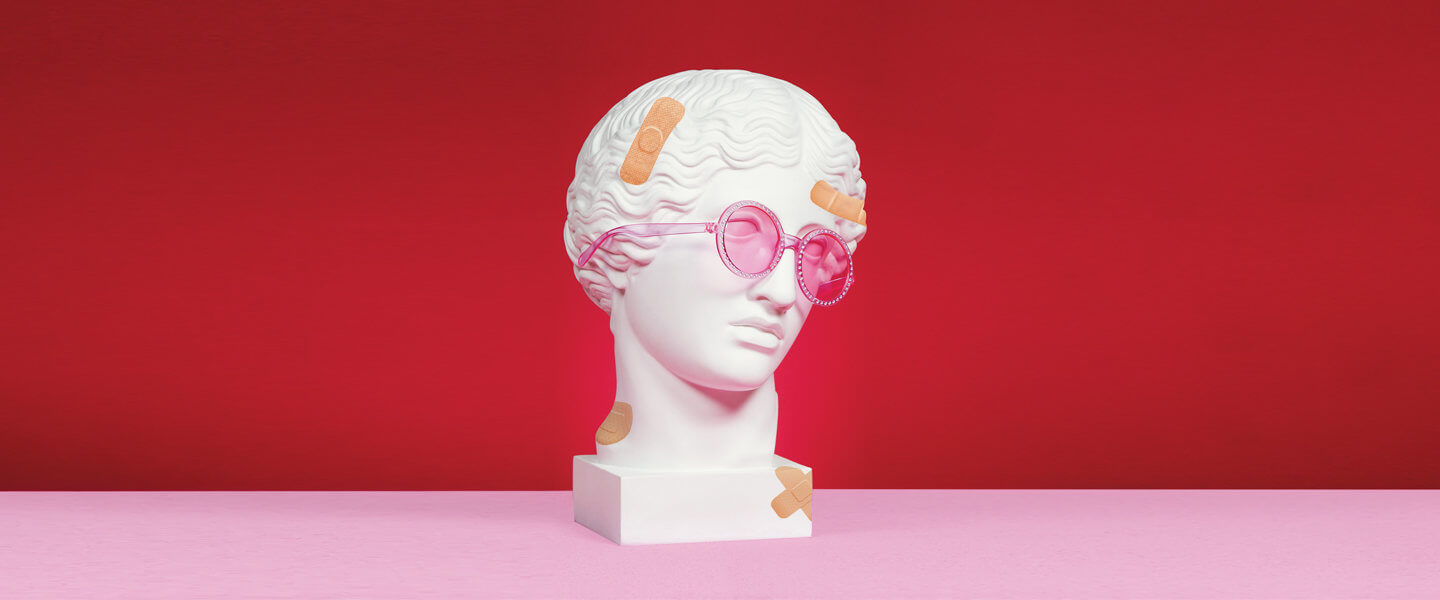 Bust of head with sunglasses and band-aids