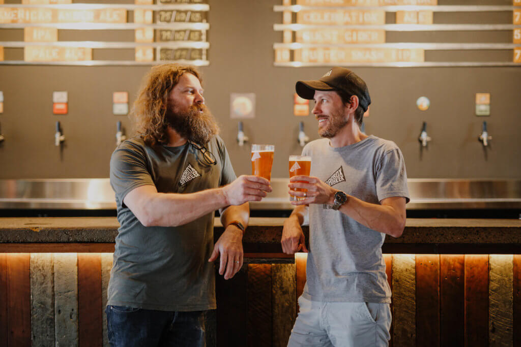 Two men drinking beer at counter of Soapbox Beer, Fortitude Valley