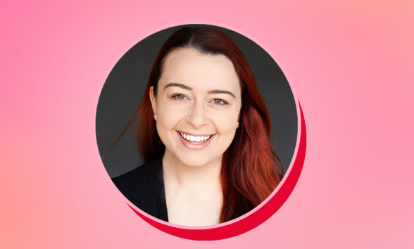 accessibility blog header Headshot of a smiling woman on a pink background