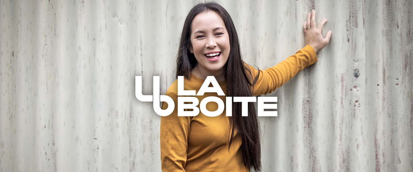 Image of new La Boite Theatre artistic director in yellow top against grey background