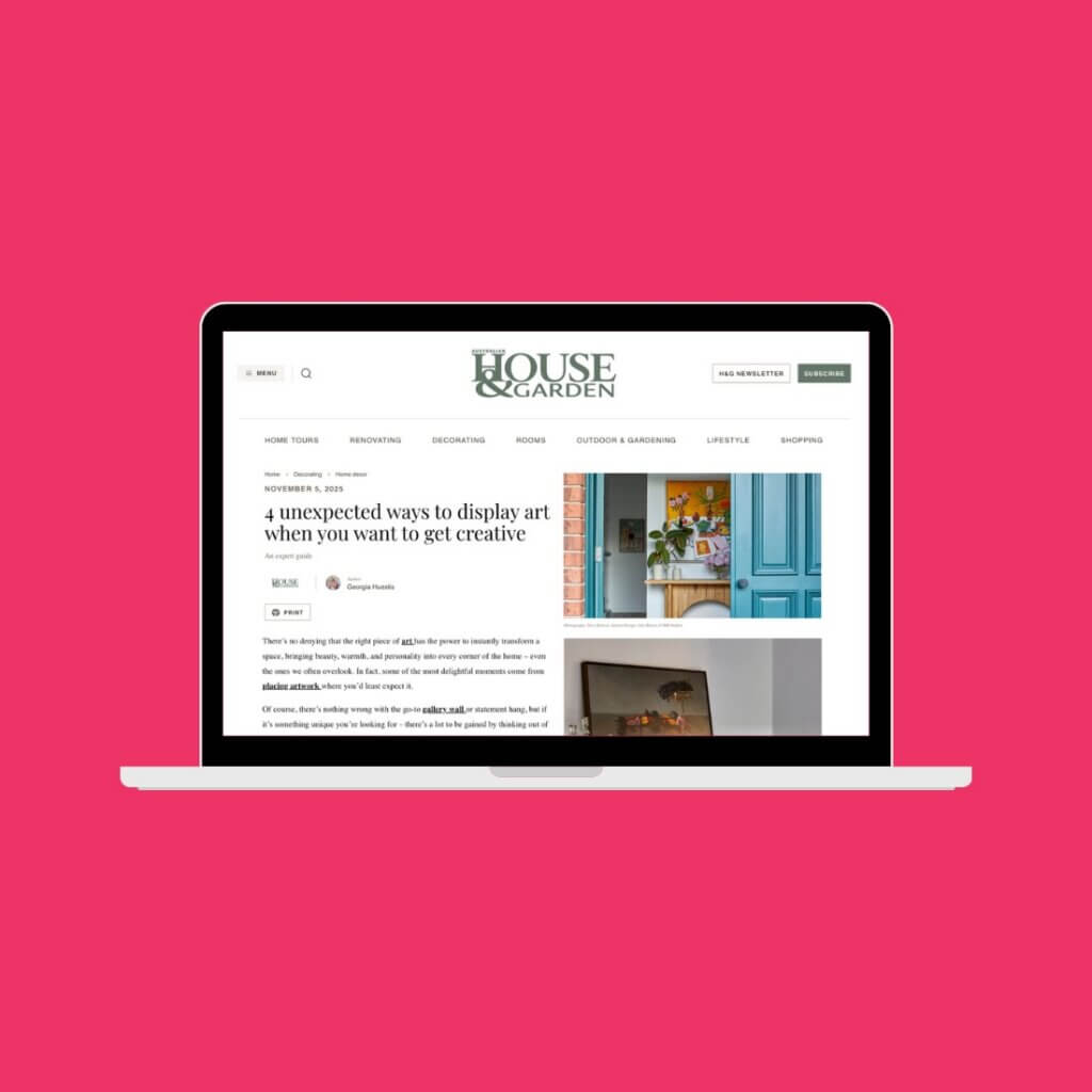 Hot pink background with laptop screen in centre, shows article on House & Garden.